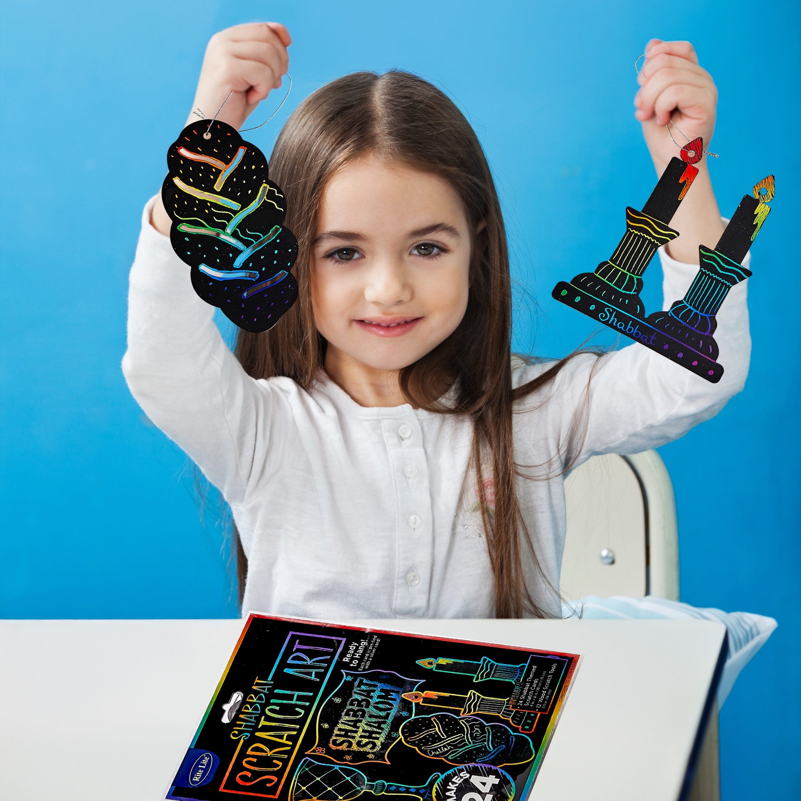 girl-showing-drawing-paper-in-preschool