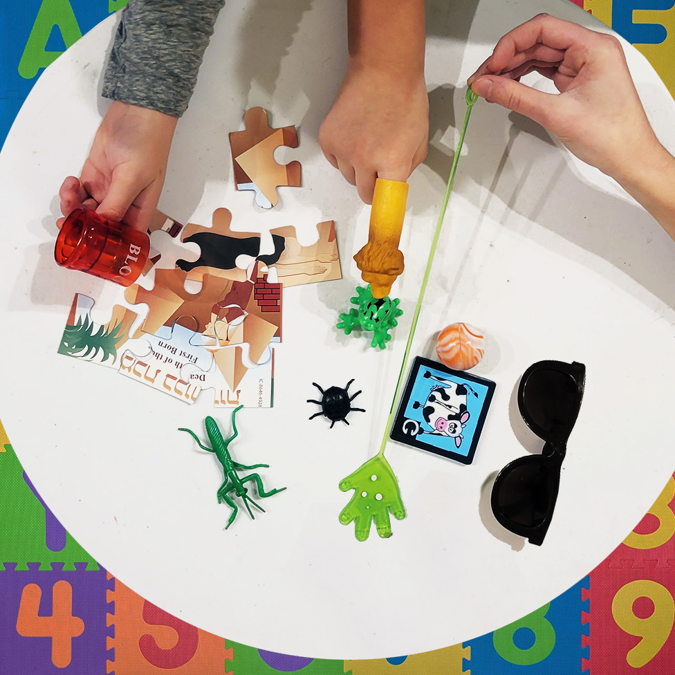 Wooden table over blurred image of kitchen bench and shelf